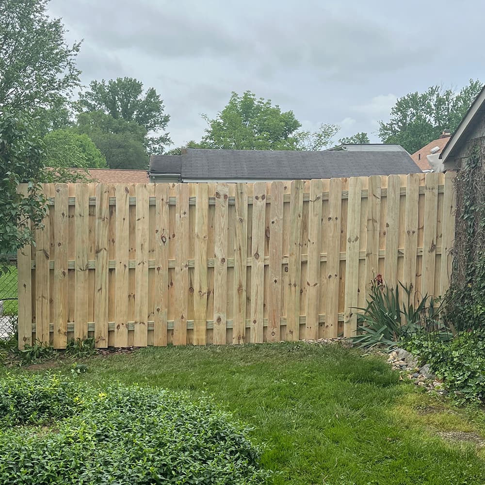 the side of a house that has a Wood Privacy Fence
