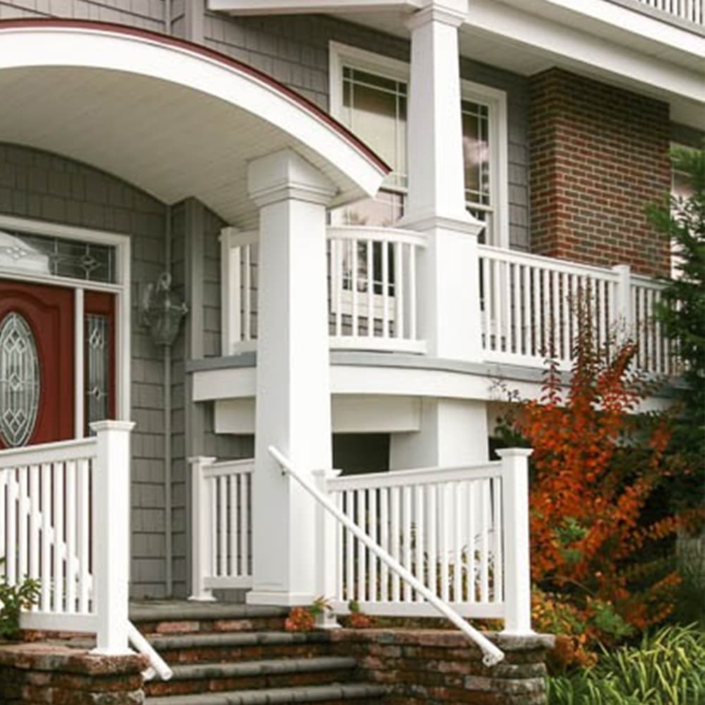 A white balcony on the second story