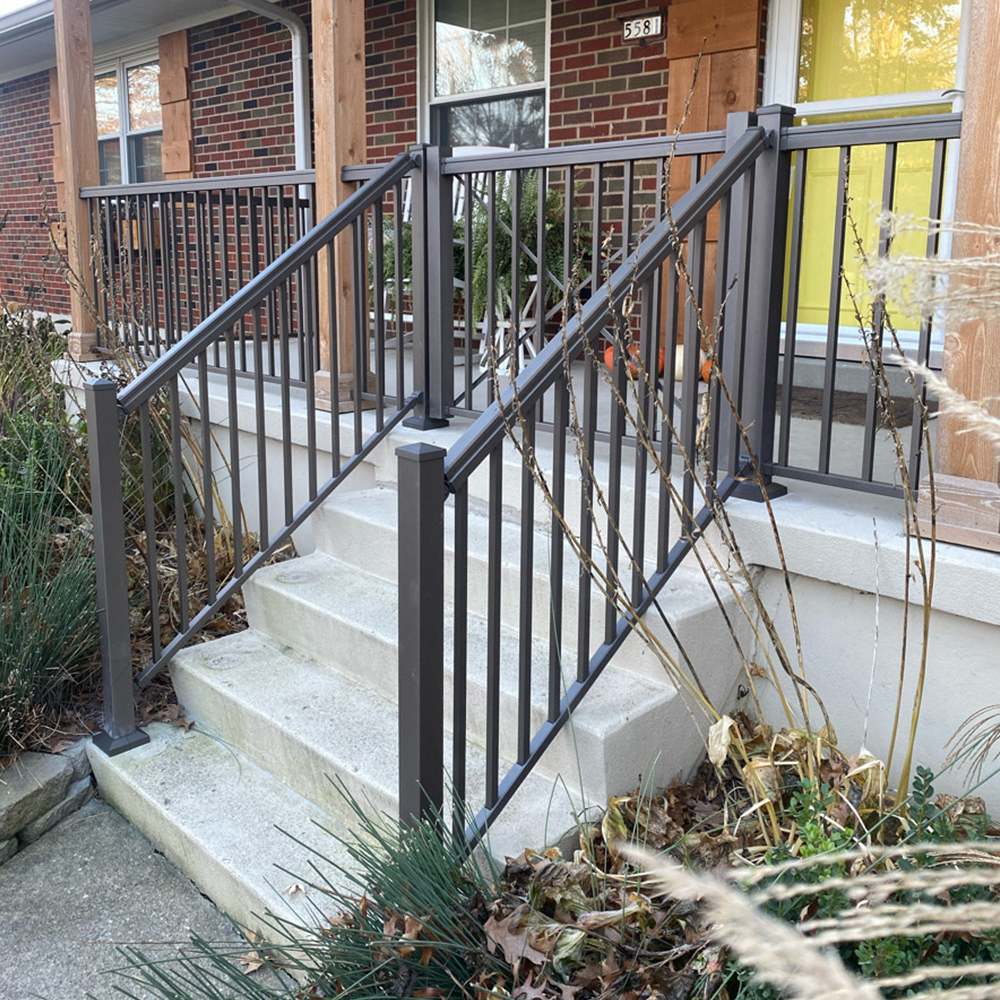 Black Stair Railings that are on the steps to the front of home
