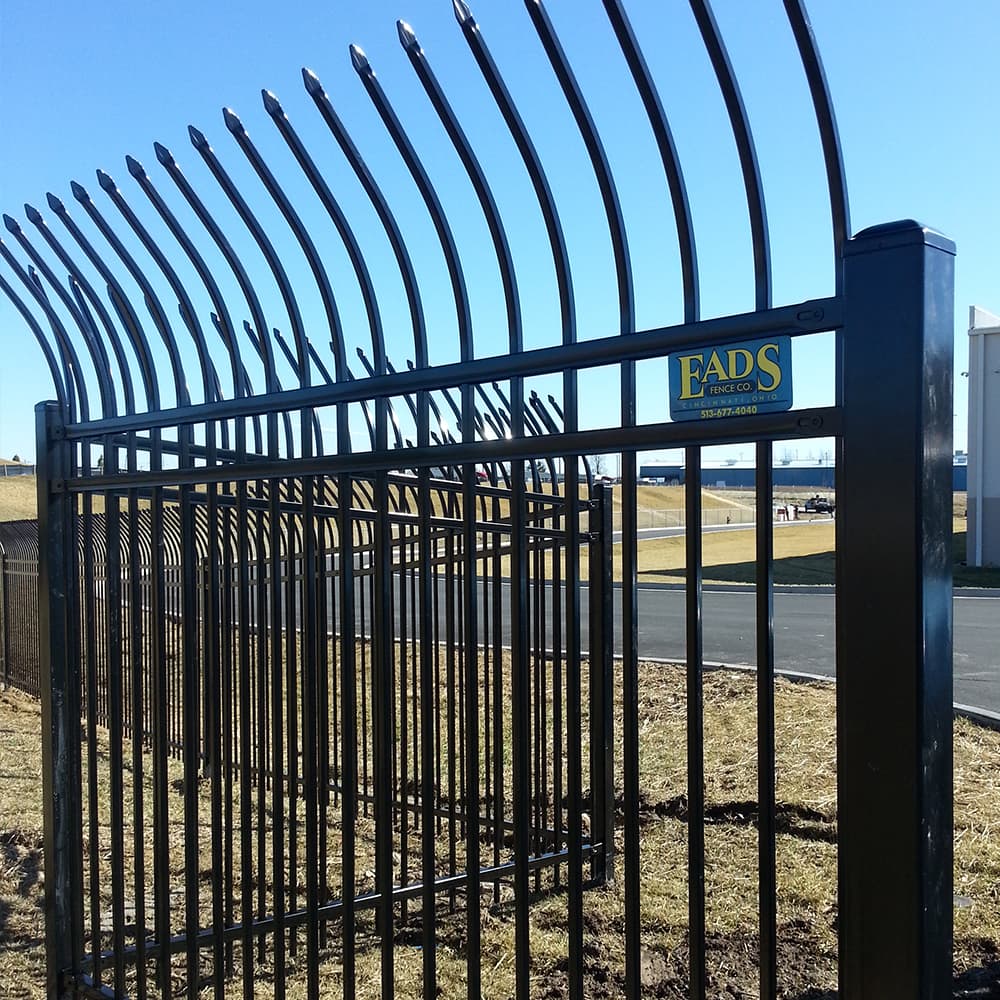 A black iron security fence with sharp points