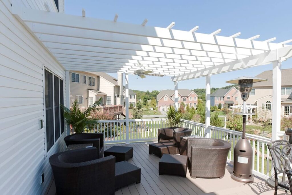 A white pergola over a deck
