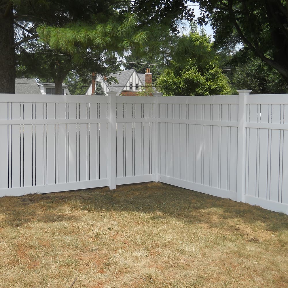 A white vinyl fence
