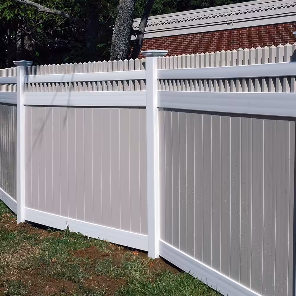 A white and tan Vinyl Privacy Fence