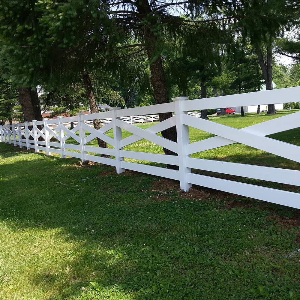 A white Vinyl Rail Fence